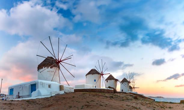 istock Traditional windmills at sunrise, Santorini, Greece 924349592