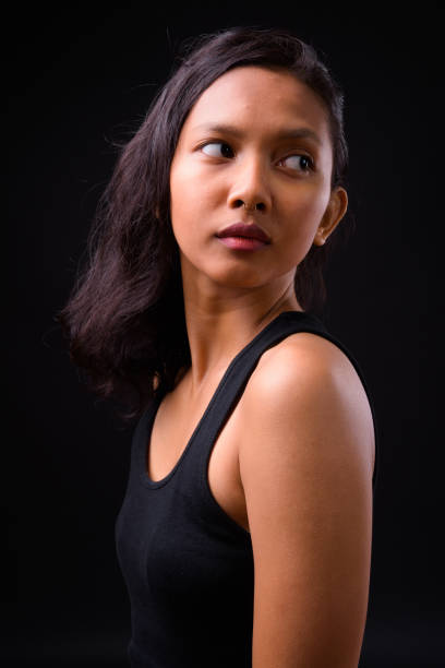 istock Young Asian Woman Thinking 924353176