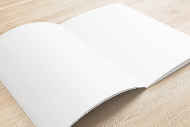 istock Opened magazine or brochure on wooden background. 924356140