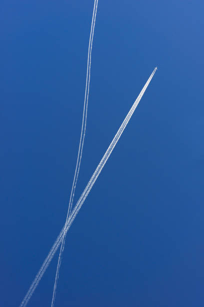 istock traces of two planes in the blue sky 924357190