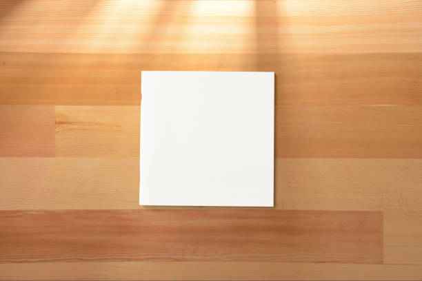 istock Square Magazine with blank soft cover on wooden background. 924357868