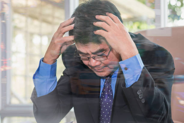istock Old businessman stressed and headache, glass reflection portrait 924360282
