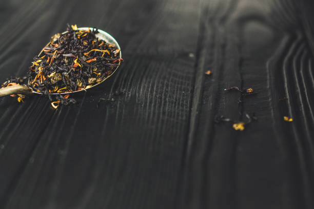 istock tea - mix of deciduous tea with fruit and flowers (black and green) 924360410
