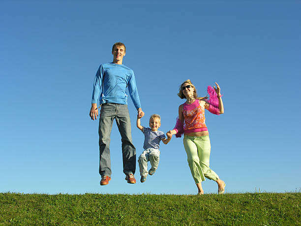 istock fly happy family on blue sky 2 92436657