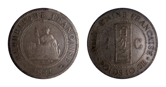 French Indochina bronze coin of one cent minted in 1887 with seated Liberty holding fascine and helm, anchor and date, and on the left side Chinese inscription and value on the right side.
