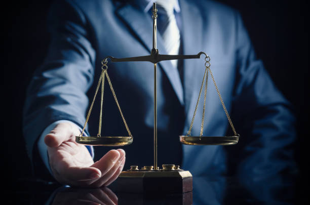 istock Weight scale of justice, lawyer in background 924372504