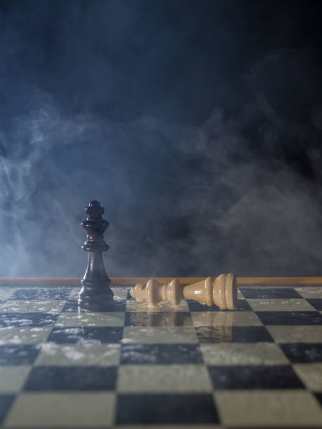 istock Chess figures on a dark background with smoke and fog. Lose and win Concept. Selective focus 924375458