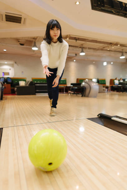 istock Japanese woman playing bowling 924378998