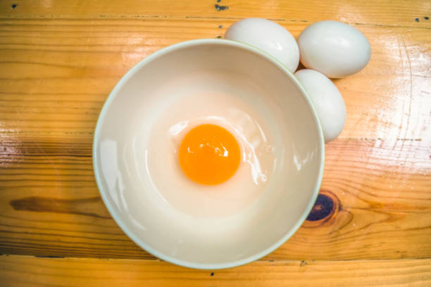 istock raw egg in a bowl, ready to cook, selective focus 924379454