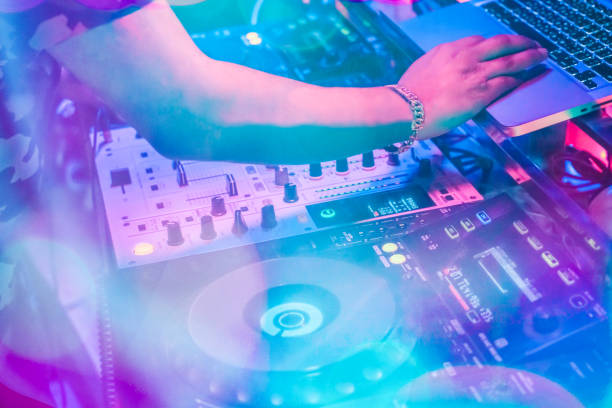 istock DJs are turntablism turntables plate mixer night party pub Motion blur wite light sunset abstract background. instagram style filter photo vintage tone 924381656