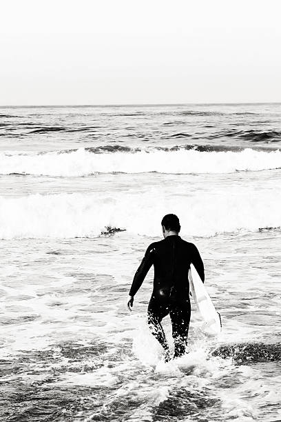 istock Black and White Photo of a Surfer 92438238