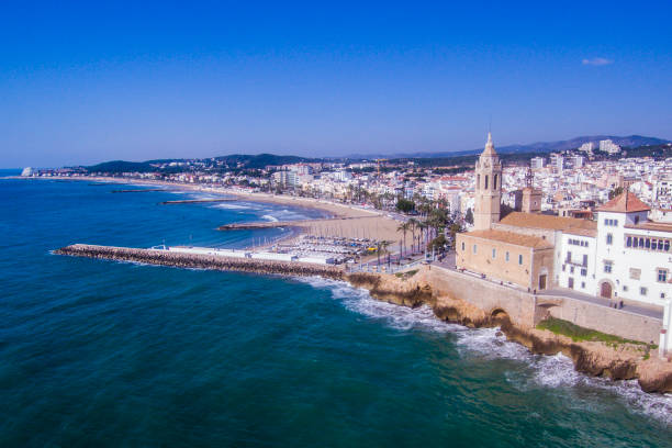 Sitges with a parish churh Sat Bartolome i Santa Tecla. Aerial view. Photographep with a drone.