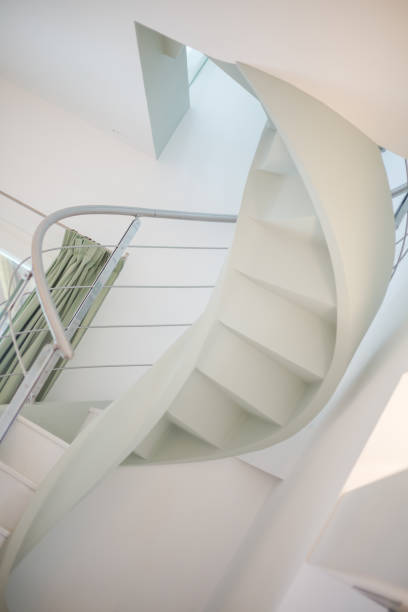 istock White staircase and metal bannister 924386246