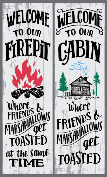 Welcome to our firepit and cabin sign Welcome to our firepit and cabin signs set. Where friends and marshmallows get toasted. Hand-drawn typography vertical sign set for home decoration or any events for the backyard. Wood sign for the cabin summer camp cabin stock illustrations