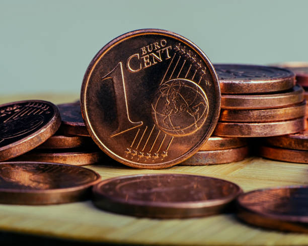 one cent coin is on coins. Euro money. one cent coin is on coins. Euro money.  Currency of the European Union. cent sign photos stock pictures, royalty-free photos & images
