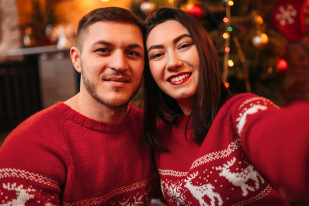 istock Love couple makes selfie, Christmas celebration 924399516