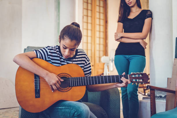 istock Cuban teenager playing guitar 924403140