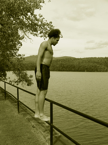 Teen Thinking of Jumping in the lake. two of two.