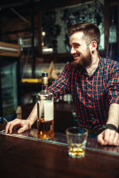 istock One man standing at the bar counter, drunkenness 924406036