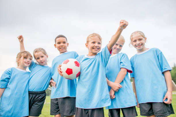 istock Happy Kids With Soccer Ball 924410956
