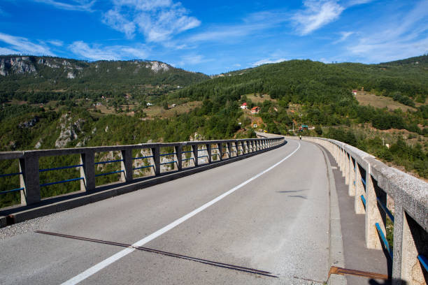 istock long road on the bridge in the mountains 924418286