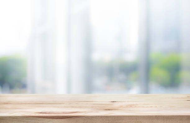 istock Wood table top on white abstract background form office building. 924418402