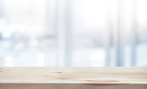 istock Wood table top on white abstract background form office building. 924418454