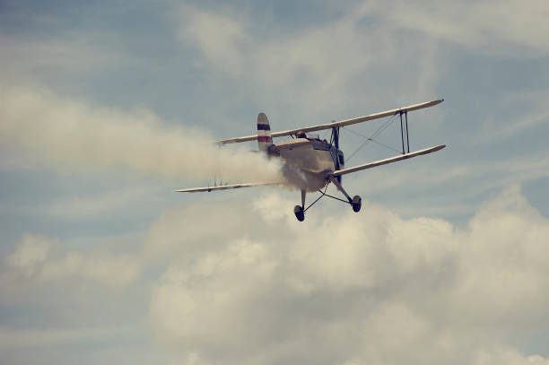 istock Vintage single engine propeller biplane aircraft flying at sunset 924425846