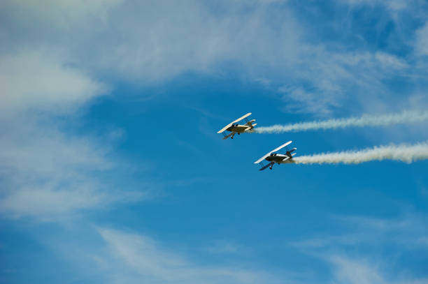 Munderloh, Germany -  August 18, 2019: An old American biplane flies over the small airfield