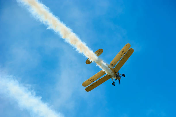 istock Vintage single engine propeller biplane aircraft flying against sky 924425902