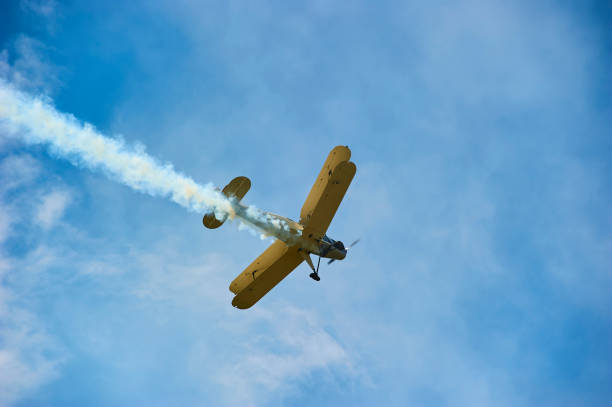 istock Vintage single engine propeller biplane aircraft flying against sky 924425920