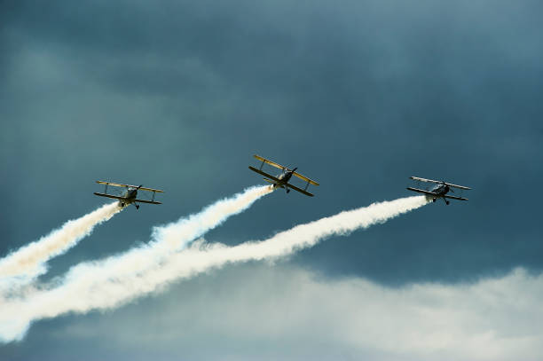 istock Vintage single engine propeller biplanes aircrafts flying 924425934