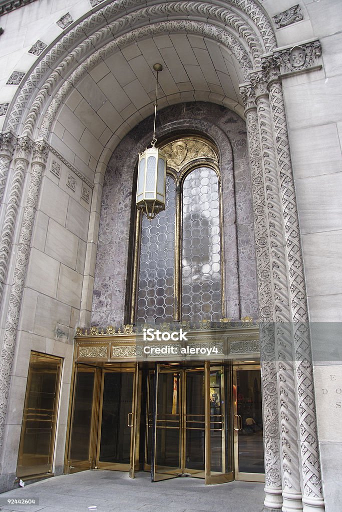 entrance 1 lovely entrance, carved arches, brass door, elegant lamp, brass carvings Architecture Stock Photo