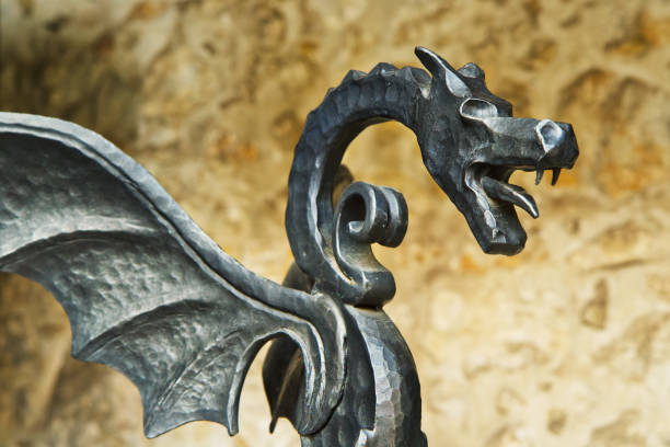 istock Forged figure of a winged dragon, old castle decoration 924428996