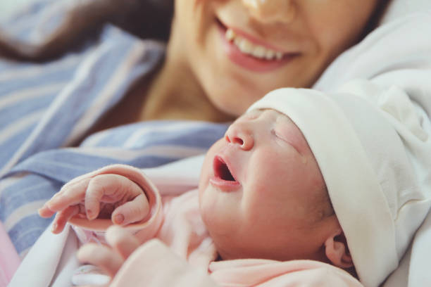 istock New born baby with his mother 924429894