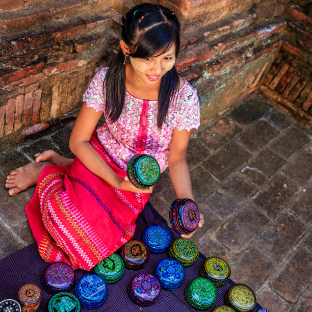 istock Young Burmese girl selling a lacquerware in Bagan, Myanmar 924430942