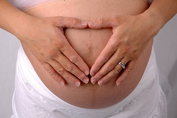 Pregnant Heart Belly stock photo