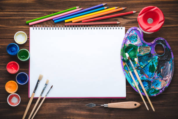 istock Set of paints, pencils, tools for painting and blank white paper sheet 924440430