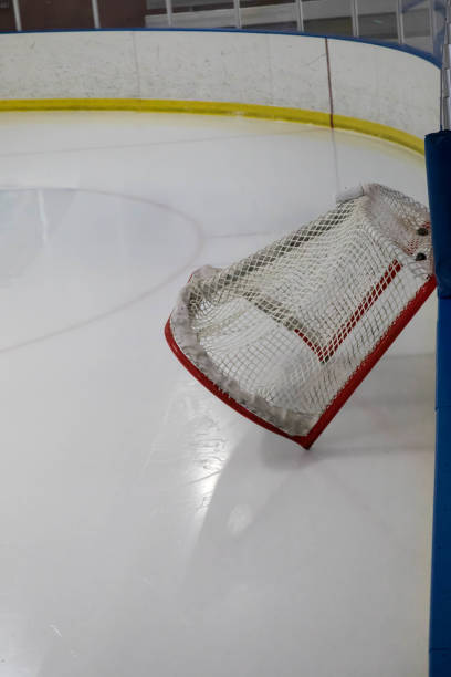 istock Hockey net tilted against the board during resurfacing 924440944