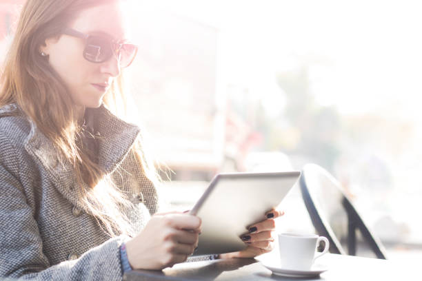 istock Woman using tablet at the cafe 924443808