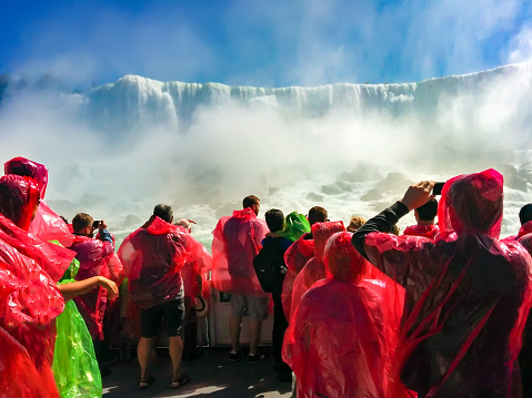 Niagara, Canada - 07 Sep, 2014: Boat Full of Tourists Gets Sprayed by Horseshoe Waterfall Under Rainbow in Niagara Falls Ontario Canada