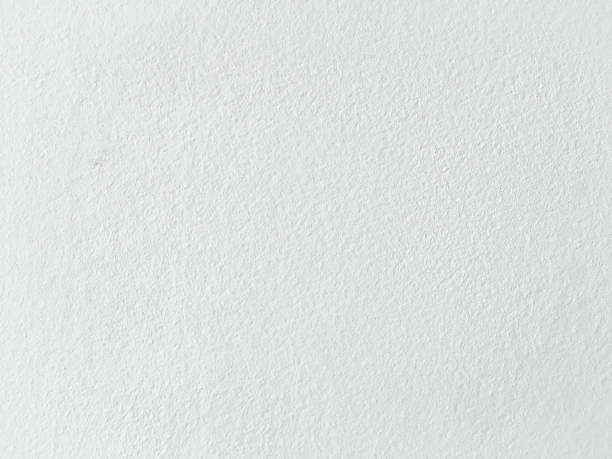 istock Grungy painted wall texture as background. Cracked concrete vintage wall background, old white painted wall. Background washed painting. 924450526