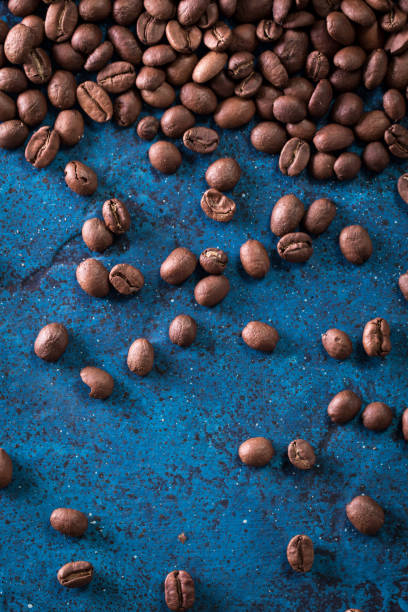 istock roasted coffee beans on blue table, can be used as a background 924454138