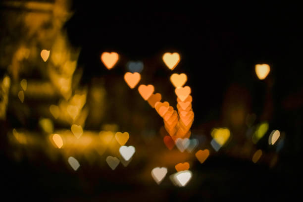 istock Heart shape bokeh from street light background, Love heart background 924454780
