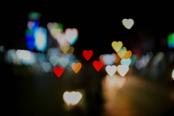 istock Heart shape bokeh from street light background, Love heart background 924454838