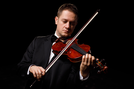 Portrait of a musician playing violin.