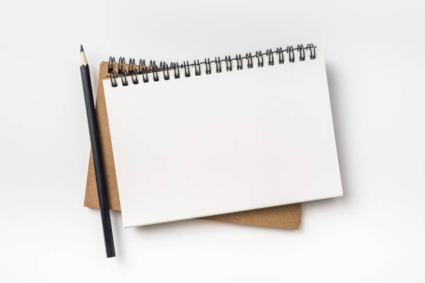 istock Top view of two kraft spiral notebook and black pencil 924460698
