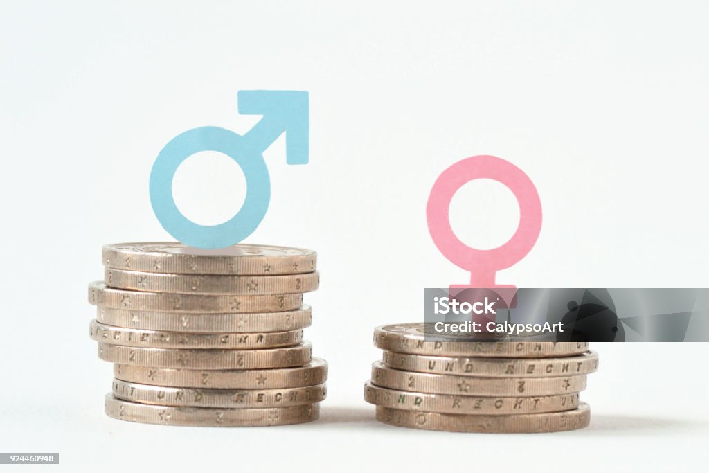 Male and female symbols on piles of coins - Gender pay equality concept Wages Stock Photo