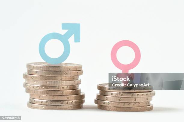 Male And Female Symbols On Piles Of Coins Gender Pay Equality Concept Stock Photo - Download Image Now