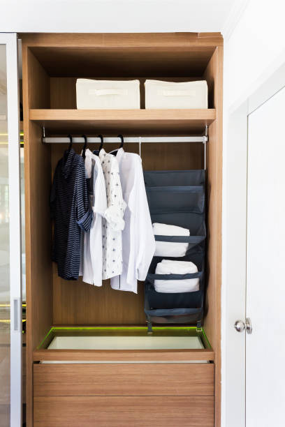 istock Shirts hanging in wooden closet, man cloth ordinary kept 924461364